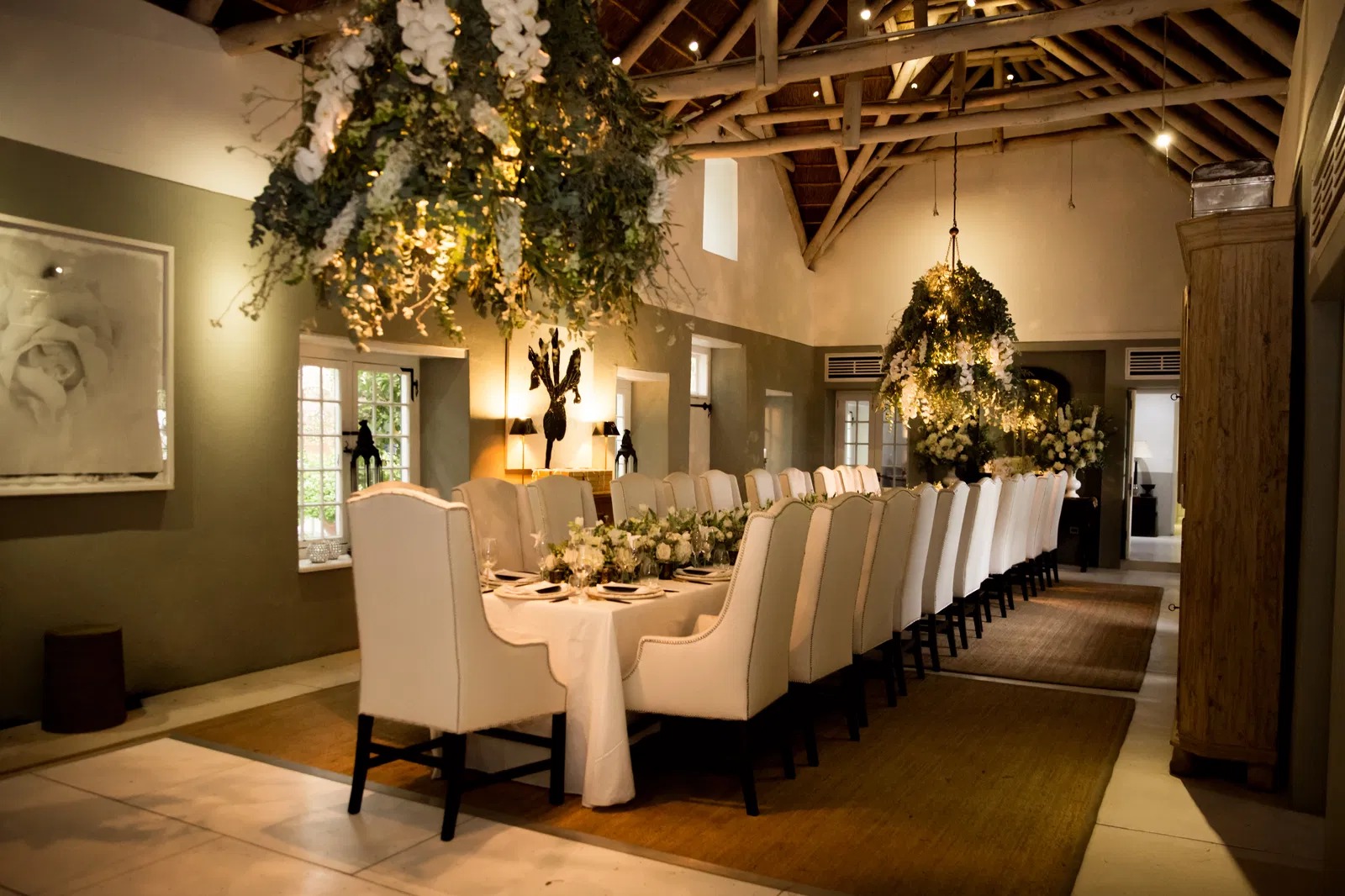 Elegant banquet hall styled with hanging floral installations